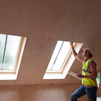 Building Inspector Looking At New Property